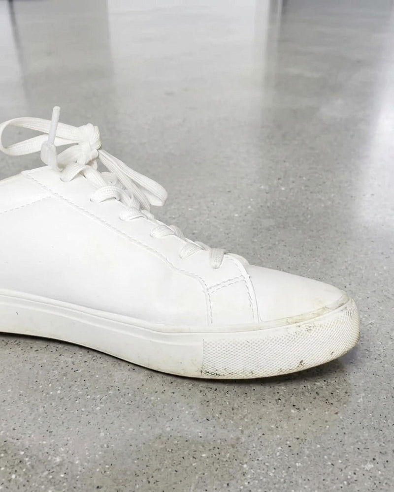 Before: white sneaker with a scuffed, greyed midsole and dirty toe cap